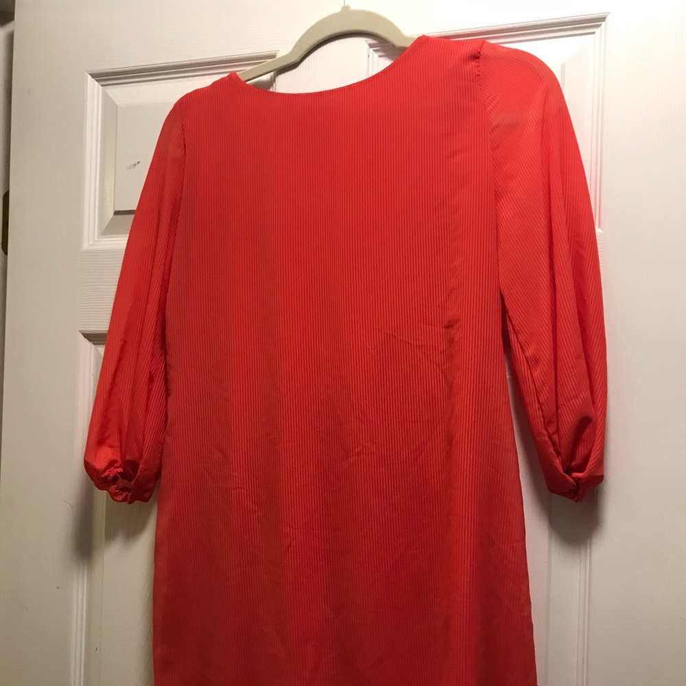 Orange shirt with green bow